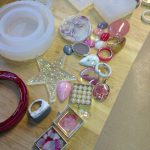 resin jewellery on a bench