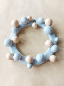 Different coloured baubles on the wreath