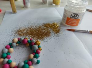 Adding glitter to the baubles