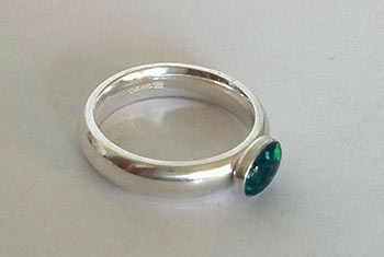Solder on extra ready- made bezels and add a stone to your ring