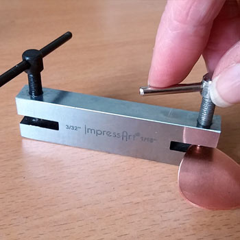 Step 2 - Make a hole in the blank using a punch