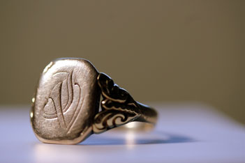 A signet ring with a crest. 