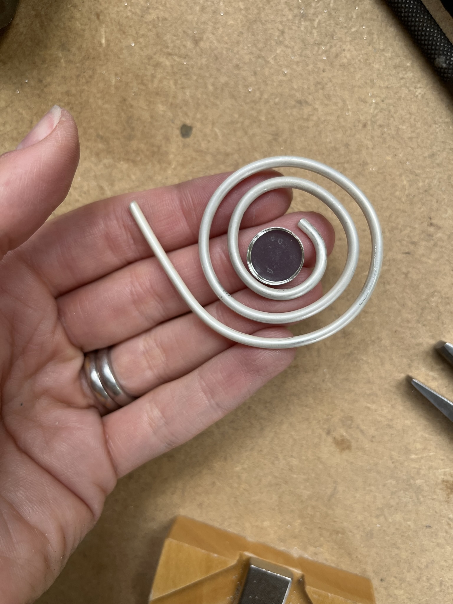 Check where bezel cup will sit next to wire