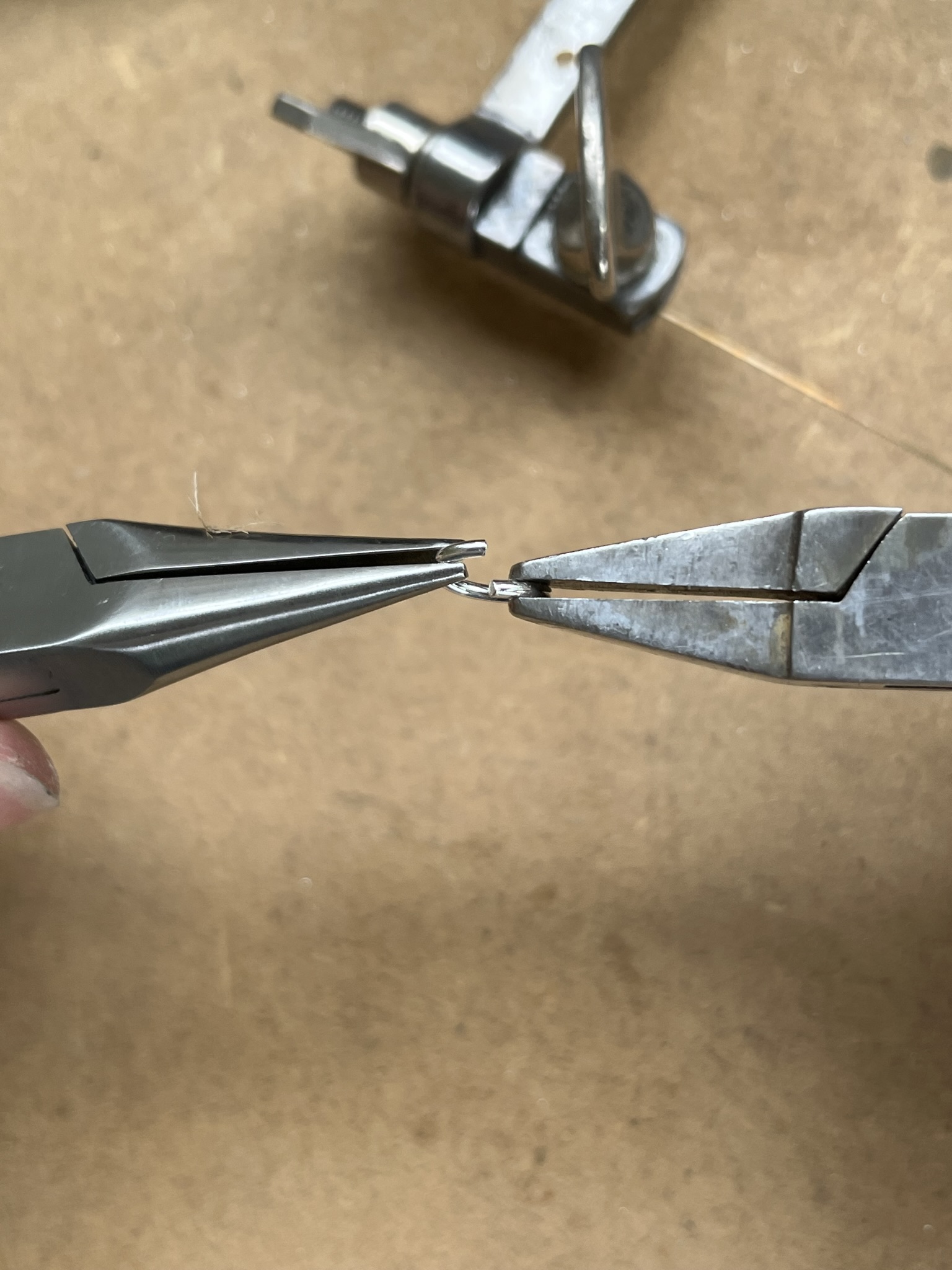 Open jump ring using pliers