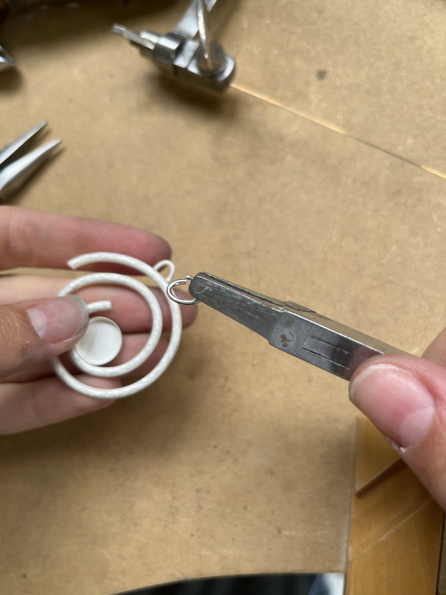 Add jump ring to silver pendant