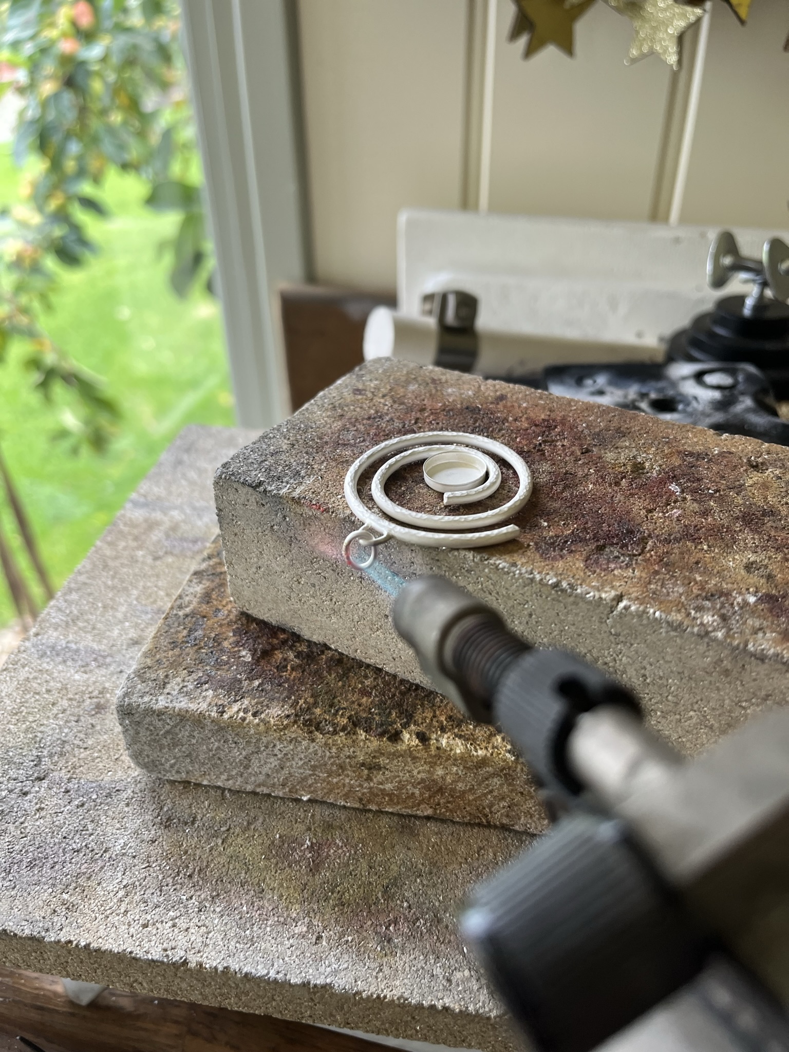 solder jump ring onto silver pendant