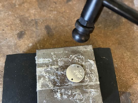 Textured jewellery making technique with a hammer on silver