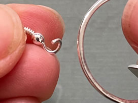 Thread earring hoop onto silver hoop to make your earring