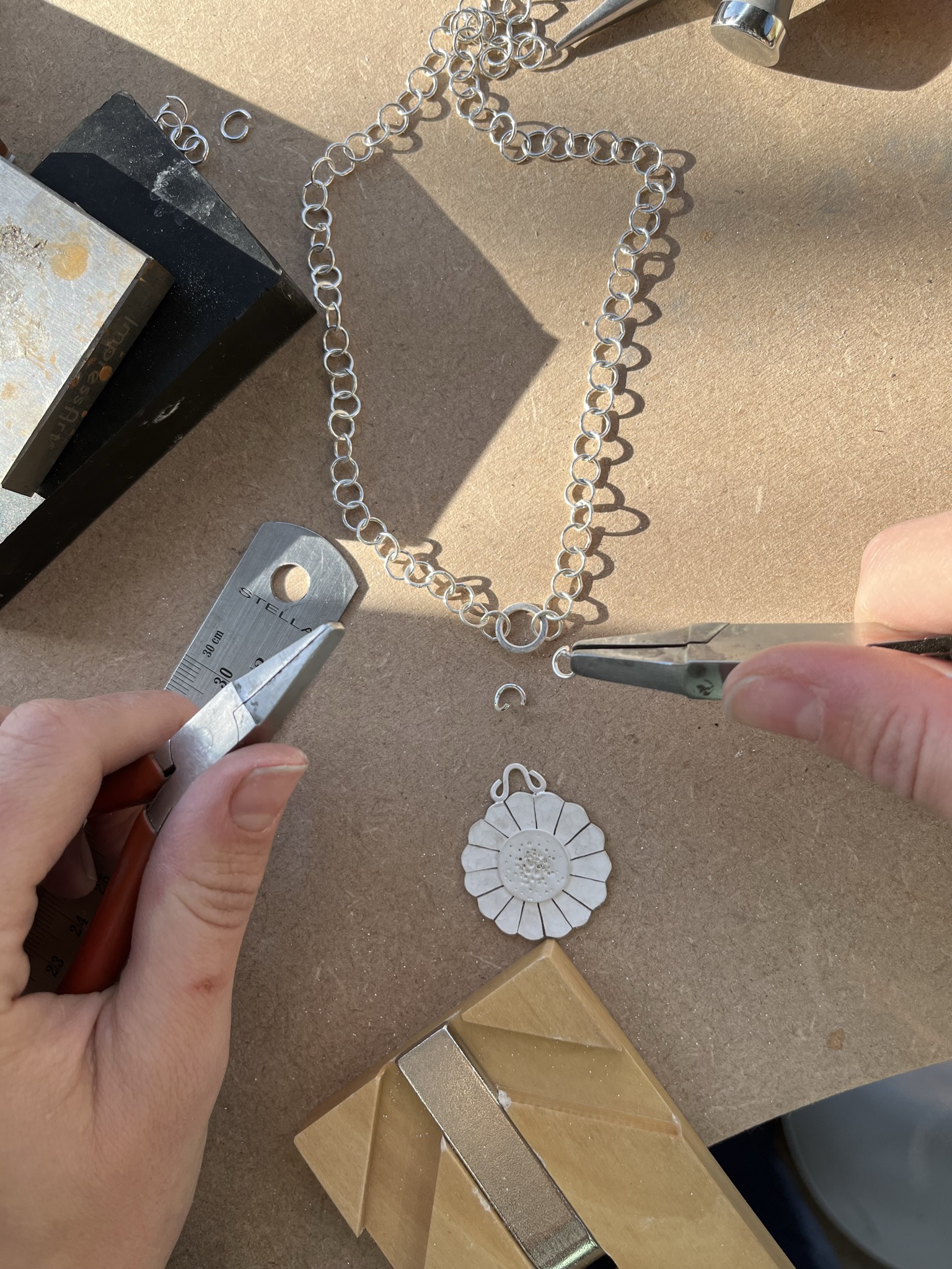 Use jumprings to attach the flower pendant.