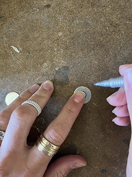 Draw a circle on the silver blank
