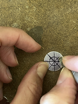 Draw lines across the disc to create equal segments