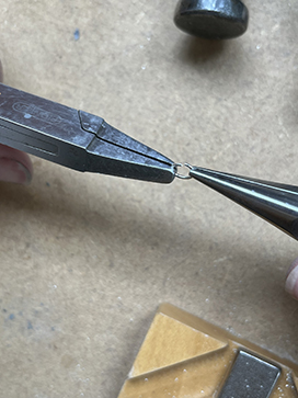 Open jump ring using pliers