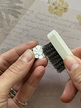 Polish silver using a brush