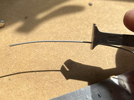 Cut the wire using wire cutters