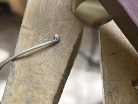 When clean, use an emery stick to smooth the ball end of each wire