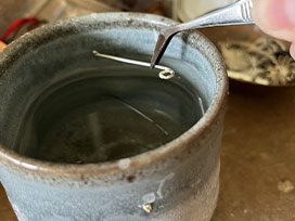 Quench (cool) each wire in water