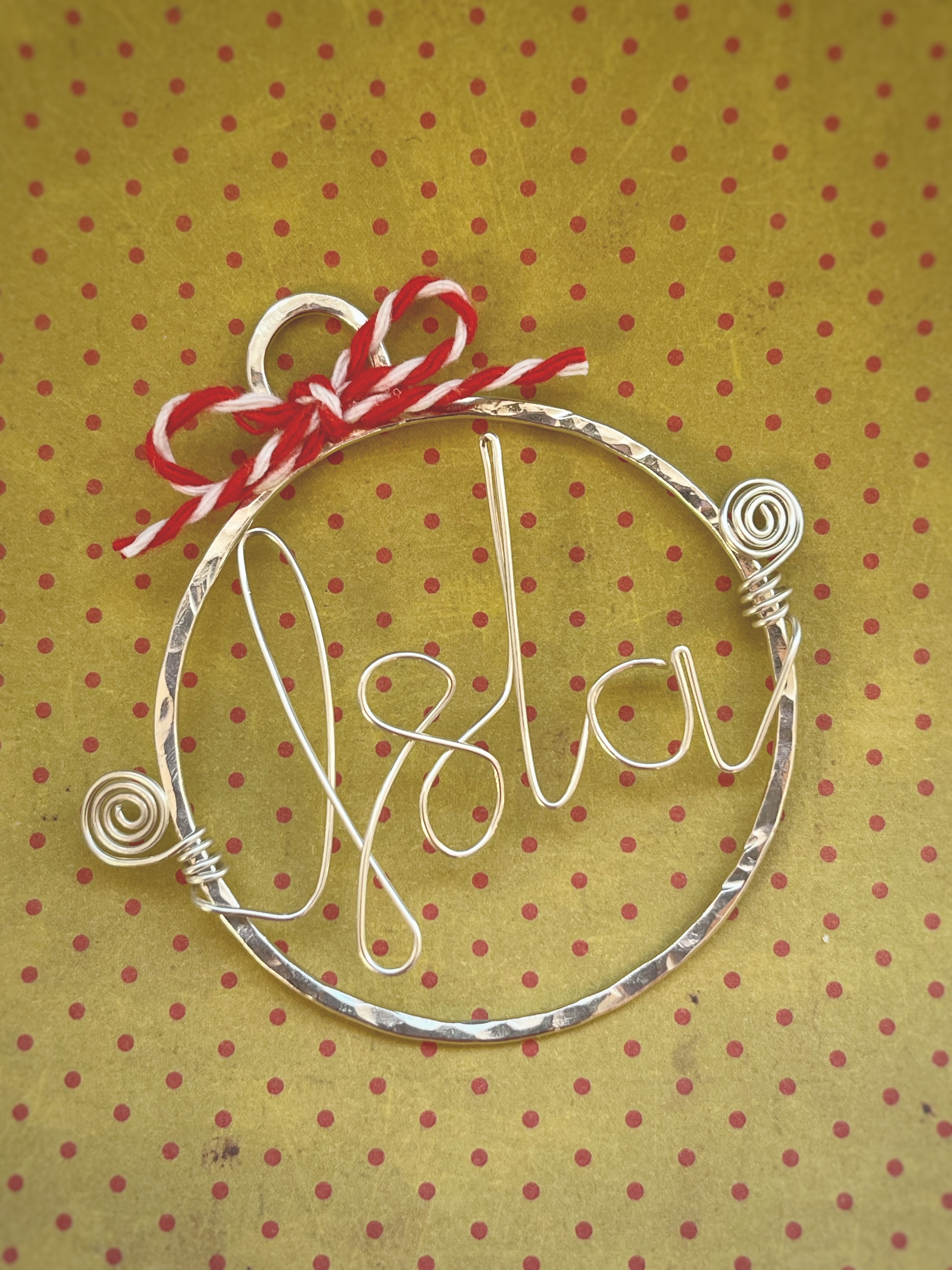 A ribbon or festive string added to the decoration. 