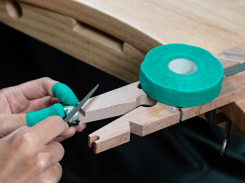 Finger protection tape protecting a jeweller's hands.