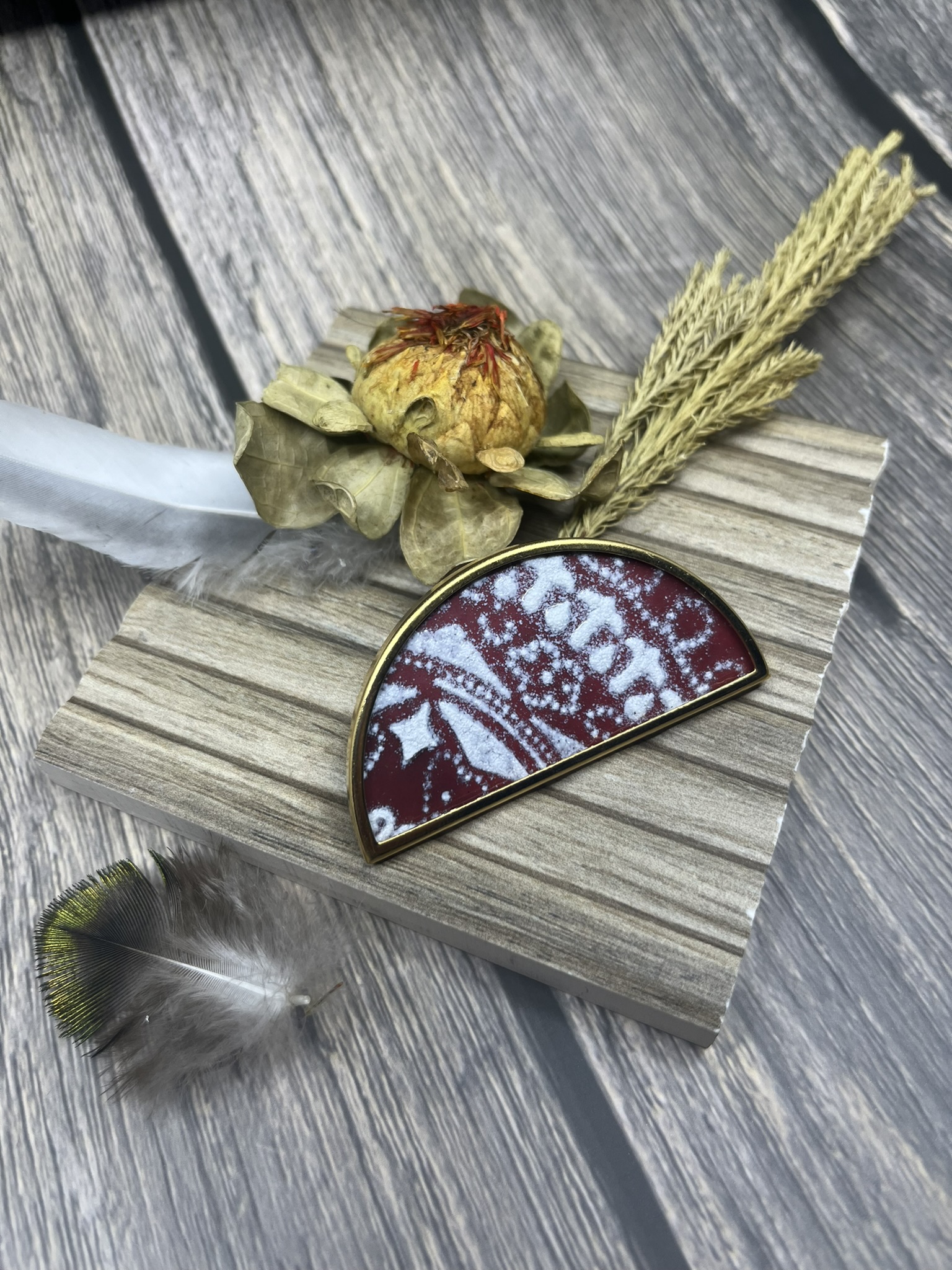 Jewellery piece photographed with several props.