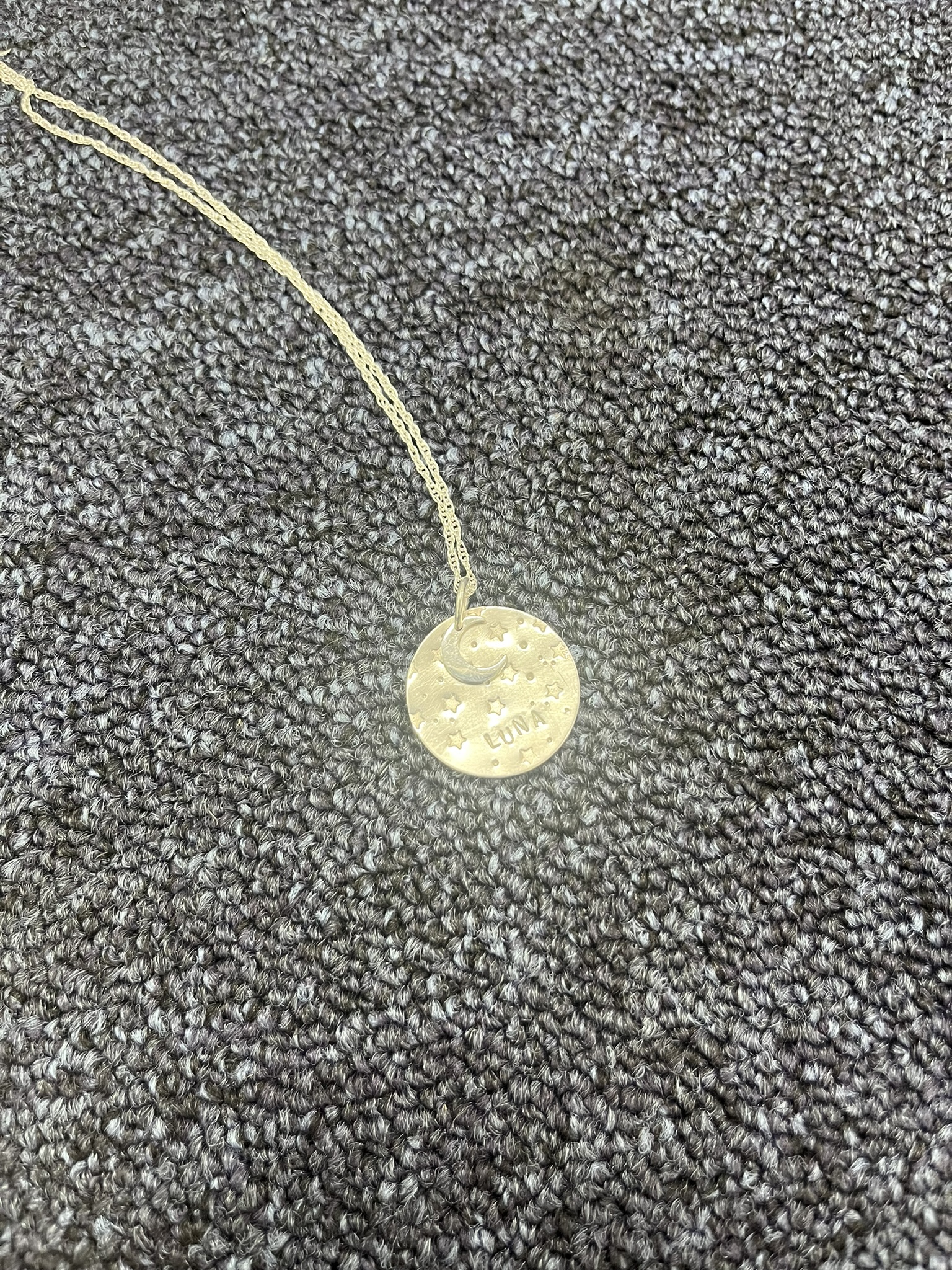Image of moon necklace without lightbox being used.