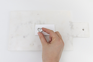 use a clay cutter to cut out a heart shape