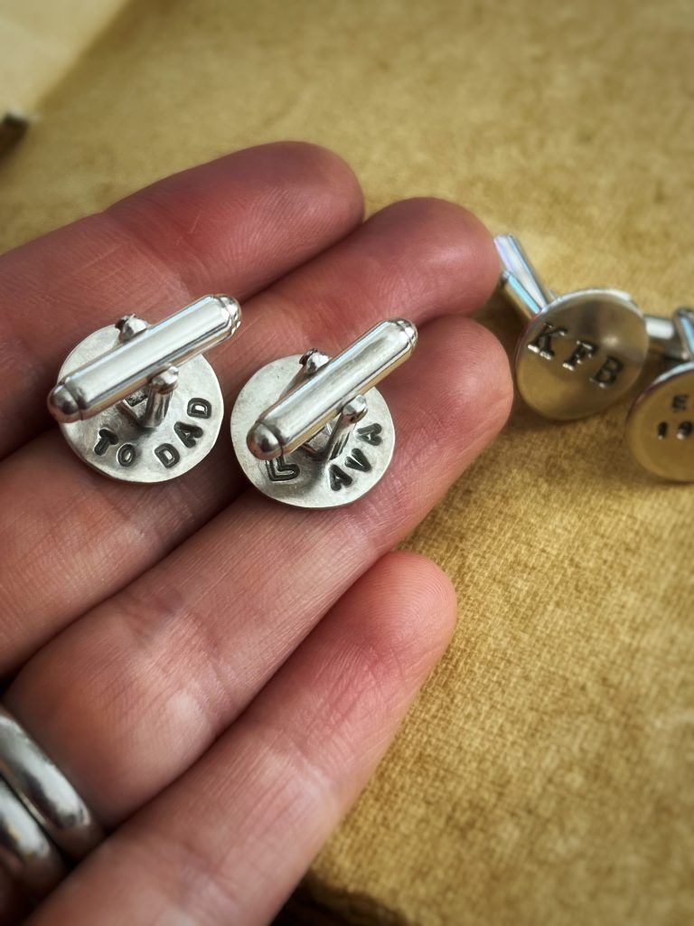 Cufflinks for Father's Day, with the name of his child.