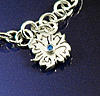 Silver birthstone charm December blue topaz.jpg