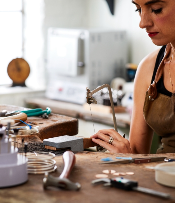 Woman at jewellers workbench